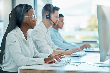 Image showing Contact us, telemarketing and crm, black woman at computer in customer service team with headset. Help desk, call center agent or sales consultant, advisory support and consulting online in office.