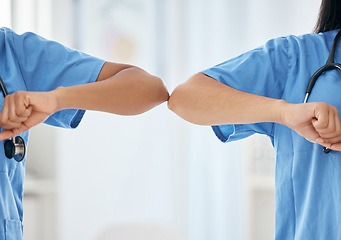 Image showing Nurse, healthcare and elbow covid greeting of medical workers in hospital or clinic. Social distancing, teamwork and nursing staff touch elbows for thank you, welcome and support in covid 19 pandemic