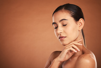 Image showing Beauty, skincare and portrait of woman in studio with luxury makeup, eyes closed and care for smooth, clean and fresh skin. Health, wellness and cosmetics, model girl from Brazil in brown background.