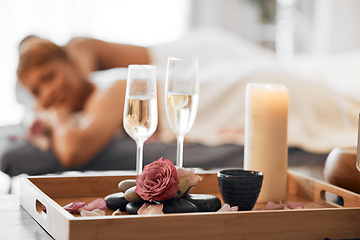 Image showing Champagne, spa massage and couple relax in zen, health and wellness salon, romance and body pamper treatment. Luxury, massage and wine at spa by woman and man enjoy peace, cosmetic and stress relief