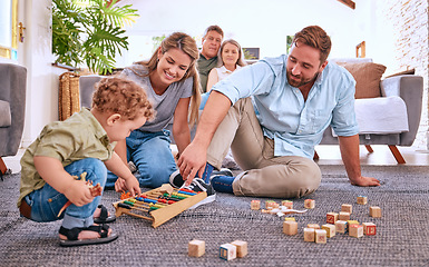 Image showing Parents, learning and child playing with toys for education and development at home. Motor skills, childhood education and little boy playing with abacus with mother and father for bonding and care