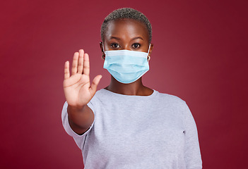 Image showing Covid, stop and healthcare with hands of black woman for safety, healthcare and global pandemic. Warning, caution and risk sign with portrait of girl for attention to virus, danger and sick