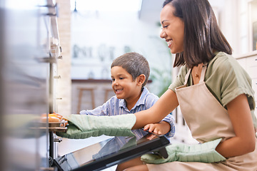 Image showing Oven, home and mother baking with her child to teach him independence while bonding in kitchen. Happiness, fun and mom from Mexico cooking dinner with son while learning about food in family house.