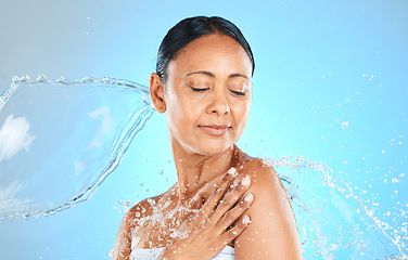 Image showing Beauty, skincare and splash with water and woman for shower, wellness or spa. Relax, refreshing or water with model against blue background for hydration, luxury or hyaluronic acid moisture cosmetics