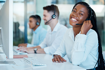 Image showing Black woman, contact us and call center employee, phone call for customer service or tech support, telemarketing sales and consultant. Agent at desk, computer and communication with technology.