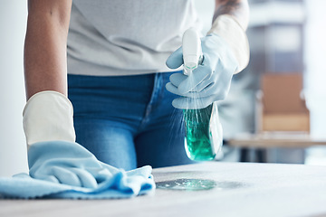 Image showing Hands spray, cleaning service and product for dust on table as cleaner on kitchen counter or dirty home furniture. Hand, worker or janitor wash a messy surface with fresh liquid and cloth with gloves