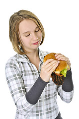 Image showing Teenage girl holding big hamburger