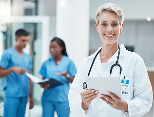 Image showing Senior woman, doctor and tablet with smile for medical research, innovation and medicine at the hospital. Portrait of elderly female healthcare professional smiling with technology for Telehealth