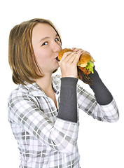 Image showing Teenage girl holding big hamburger