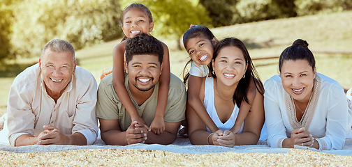 Image showing Relax, nature and big family on a happy picnic to enjoy quality time, bonding and summer holidays vacation. Grandparents, mother and father with children siblings smile together in a group portrait