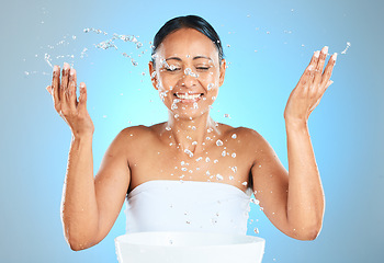 Image showing Water splash, skincare and beauty of a woman with a smile with healthy and skin wellness. Happy hygiene treatment and morning facial routine of a female model face with happiness about grooming