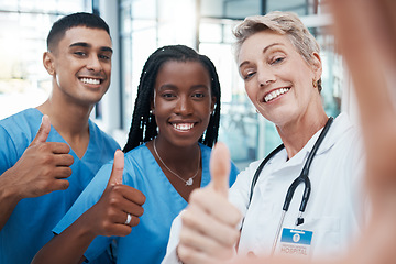 Image showing Selfie, doctor and students with thumbs up portrait at hospital for success, diversity and healthcare. Interracial, teamwork and agreement of professional medical people with smile for cooperation.