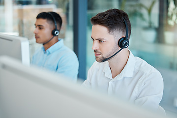 Image showing Call center, focused businessman and helping with customer service advice online. Operator, telemarketing and consultant offering digital support using a headset. Hotline agent, contact us and help