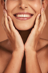 Image showing Dental, oral care and closeup of woman teeth with whitening, hygiene and health in a studio. Happy, smile and girl model with a natural, clean and healthy mouth isolated by a brown background.