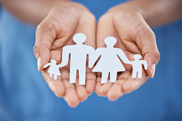 Image showing Hands, paper and advertising for family insurance, support and trust with charity, values or community. Woman hand for marketing kindness, family cutout of people with planning life for future