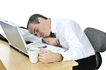 Image showing Businessman asleep at his desk on white background