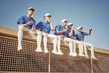 Image showing Sports, baseball and team of men together smiling and happy sitting in row eating apple. Smile, teamwork and professional baseball team relax watching competition game or training workout session.