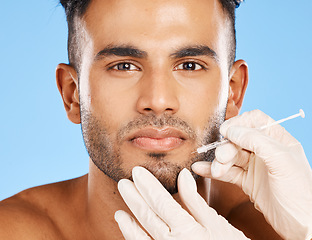 Image showing Man, needle and cosmetic facial care anti-aging wrinkles treatment. Healthcare nurse hands, face skincare beauty aesthetic plastic surgery and medical dermatology wellness in blue background studio