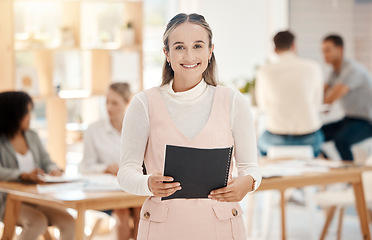 Image showing Marketing, office and portrait of a happy woman with a smile holding a notepad for a meeting with team. Creative, professional and employee from Canada working on project with colleagues in workplace