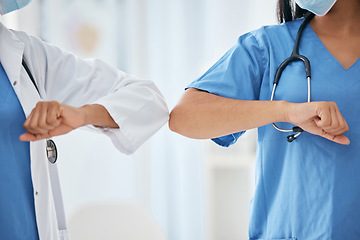Image showing Covid doctor greeting elbow, closeup hospital and ppe work clothes for corona healthcare in workplace. Nurse medic hello, arm touch for social distance or covid 19 medical health safety in clinic