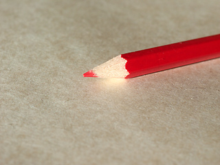Image showing Red pencil over paper