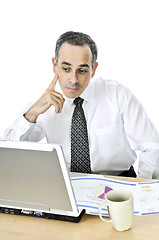 Image showing Businessman at his desk on white background