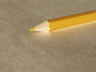 Image showing Yellow pencil over paper