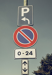 Image showing Vintage looking No parking sign over blue sky