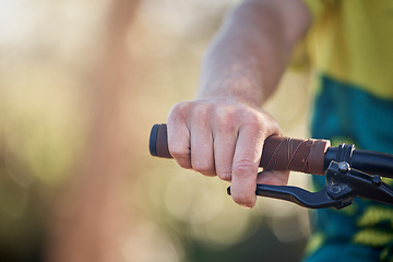 Image showing Bike, travel and hands of cycling man riding a bicycle for cardio training, fitness workout or exercise for marathon race. Mountain bike, handle bar and adventure person on freedom journey in nature