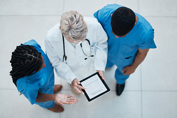 Image showing Medical, consulting and teamwork with doctors and tablet and top view for collaboration, review or meeting. Healthcare, research and planning with nurse and senior employee for digital and technology