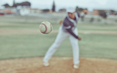 Image showing Baseball, sports and athlete pitching with a ball for a match or training on outdoor field. Fitness, softball and pitcher practicing to throw with equipment for game or exercise on a pitch at stadium