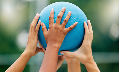 Image showing Netball, hands and woman holding a ball during a game for support, teamwork or training together. Sports, community and collaboration for a team of athlete people at a sport event with solidarity