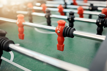 Image showing Foosball, game and table for entertainment, fun and team activity with artificial toy or players in zoom. Plastic, arcade and games for competition, competitive and miniature football or soccer field
