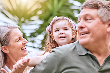 Image showing Summer, fun and grandparents with girl in the park enjoying weekend, holiday and quality time. Family, love and child playing in garden with grandma and grandfather bonding and having fun in nature