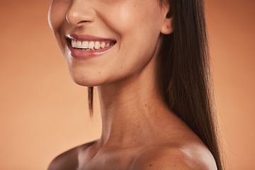 Image showing Beauty, smile and cropped face of woman pose for makeup, cosmetics and beauty products. Wellness, skincare and lips of happy girl with healthy, natural skin and body care in orange background studio