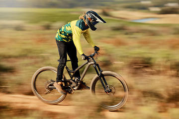 Image showing Speed, action and man on mountain bike for dirt racing sports, riding on nature trail. Sports, mountain biking and blur of athlete cycling fast on dirt road for fitness, adrenaline and adventure