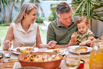 Image showing Family, dinner and eating food at restaurant together smile and happy grandparents bonding with child. Elderly couple, healthy leisure lifestyle and wellness teaching or feeding kid vegetable stew.