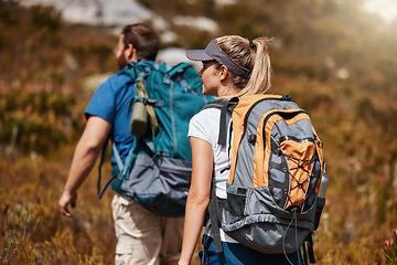 Image showing Hiking, fitness and adventure with a couple in nature for exercise or a weekend getaway in summer. Forest, mountain and travel with a man and woman walking outdoor for health or freedom together