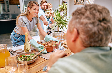 Image showing Thanksgiving, celebration and family serving food, having lunch together in family home. Grandparents, parents and child ready to eat turkey on holiday, festival and vacation, celebrating tradition