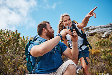 Image showing Hiking, couple and in nature to relax, talking and enjoy the outdoor view for fresh air. Health, man and woman point have speaking with tourist, mountain range or vacation with binocular and wellness
