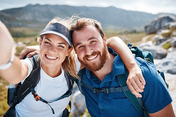 Image showing Hiking, happy and couple taking a selfie by a mountain in nature while walking or trekking with freedom in Canada. Smile, memory and healthy woman loves taking pictures when traveling on fun holidays