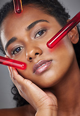 Image showing Face, beauty and serum with a model black woman in studio on a gray background for health or wellness. Portrait, skincare and antiaging with a female closeup to promote a product for healthy skin