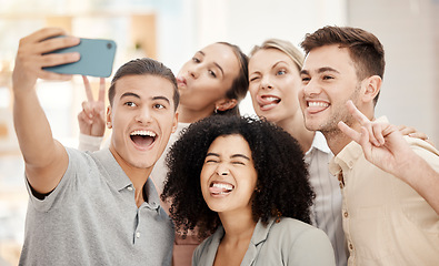 Image showing Phone, selfie and work friends with funny faces at team building event or meeting in office. Comic, diversity and goofy business people in collaboration having fun and taking picture in the workplace