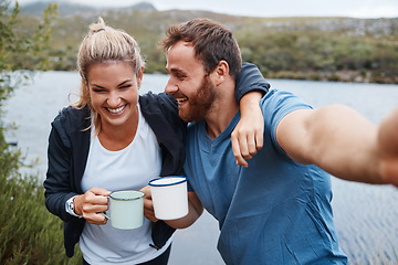 Image showing Nature, camping and selfie couple with coffee drink happy with adventure vacation at Mexico lake. Holiday, relax and happiness of people enjoying warm beverage in camper mug photograph.