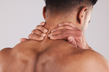 Image showing Injury, neck and hands of man in pain feeling muscle tension, inflammation and spine for treatment marketing. Accident, problem and physical trauma of person in grey studio with mockup.