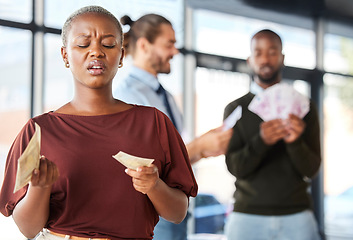 Image showing Black woman, unequal pay and confused by wages, paycheck and quote in office, frustrated and annoyed. Angry, woman and reading salary slip with happy colleagues in background, unfair and compensation