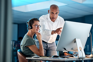 Image showing Leadership, training and manager in call center coaching a telemarketing employee for quality customer services. Contact us, crm and mentor teaching an insurance agent on new job tasks on a computer