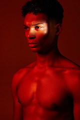 Image showing Red, light and body, beauty and man isolated on studio background. Neon light, serious facial expression and male model from Brazil thinking, lost in thought or focus on fitness, health and wellness.