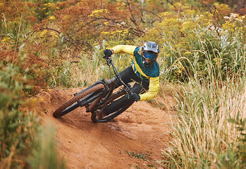 Image showing Mountain bike race, man and cycling adventure on dirt path, sand hill and speed challenge, sports action or fast athlete in Norway. Bicycle cyclist, fitness and cardio freedom in outdoor nature trail