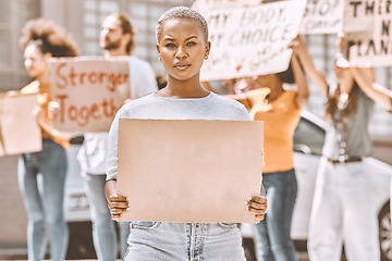 Image showing Protest, sign and mockup with a black woman activist holding cardboard during a rally or demonstration. Poster, freedom and politics with a young female fighting for human rights or equality